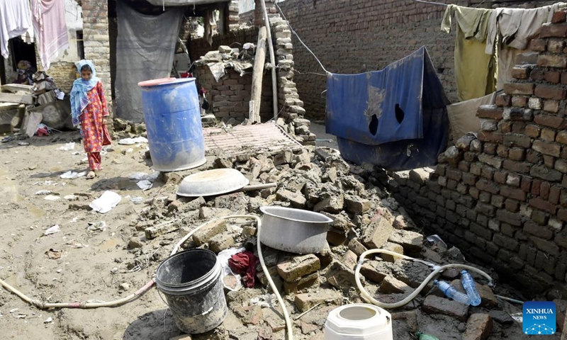 A girl is seen in her partially damaged house after heavy monsoon rain in northwest Pakistan's Nowshera on Sept. 6, 2022. At least 11 people were killed in heavy monsoon rain-triggered flash floods in the last 24 hours in Pakistan, the National Disaster Management Authority (NDMA) said.(Photo: Xinhua)