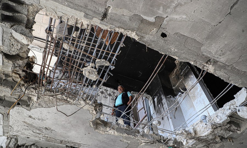 A man looks at the damages of an apartment which was damaged by Israeli airstrike in Gaza City on Sept. 6, 2022.(Photo: Xinhua)