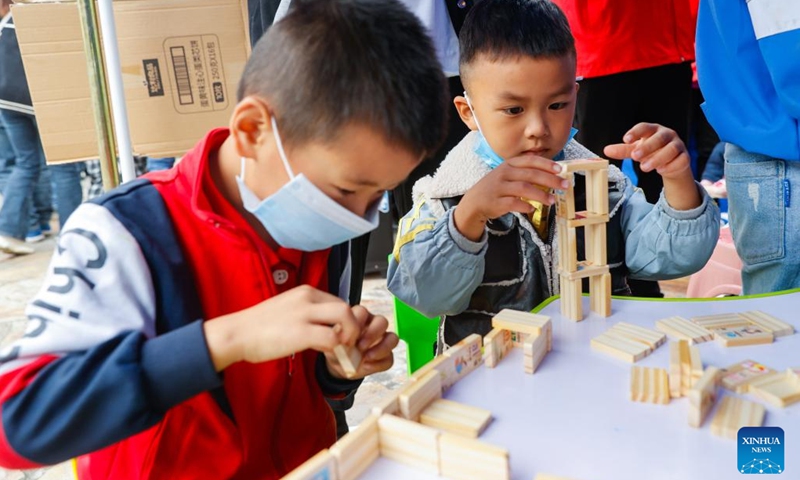 Two boys play at a children's center at a quake relief shelter in Moxi Town of Luding County, southwest China's Sichuan Province, Sept. 7, 2022. A children's center has been built up at a quake relief shelter in Moxi Town to take care of children affected by the earthquake.(Photo: Xinhua)