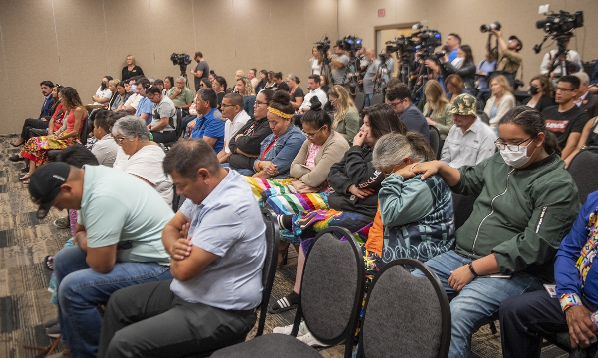 People look on as Mark Arcand who's sister Bonnie Burns and nephew Gregory Jonesy Burns were killed during a series of violence attacks at James Smith Cree Nation and Brian Buggy Burns, Bonnie Burns's husband, speak at a press conference in Saskatoon, Wednesday, Sept. 7, 2022. Photo: VCG