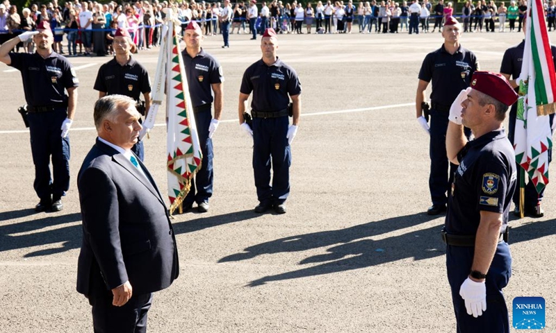 Hungarian Prime Minister Viktor Orban (front, L) inspects the members of Hungary's first border hunter regiment at the inauguration ceremony in Budapest, Hungary on Sept. 9, 2022. The first border hunter regiment was inaugurated here on Friday. (Photo by Attila Volgyi/Xinhua)