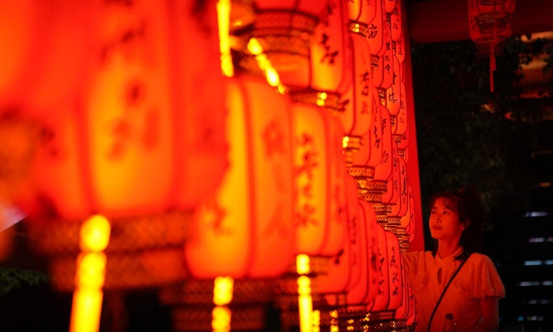 A visitor views Mid-Autumn Festival light installations at the Tengwang Pavilion scenic spot in Nanchang, capital of east China's Jiangxi Province, Sept. 10, 2022.Photo:Xinhua