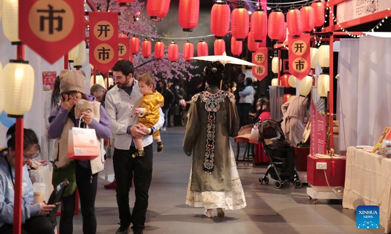 People stroll in a traditional street market to celebrate the Chinese Mid-Autumn Festival in Melbourne's Meat Market, Australia on Sept. 10, 2022.Photo:Xinhua