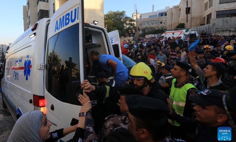 Rescuers transfer a victim to an ambulance after a residential building collapsed in Amman, Jordan, on Sept. 13, 2022. The death toll in the residential building collapse in Amman on Tuesday rose to five, the Public Security Department (PSD) said in a statement.(Photo: Xinhua)