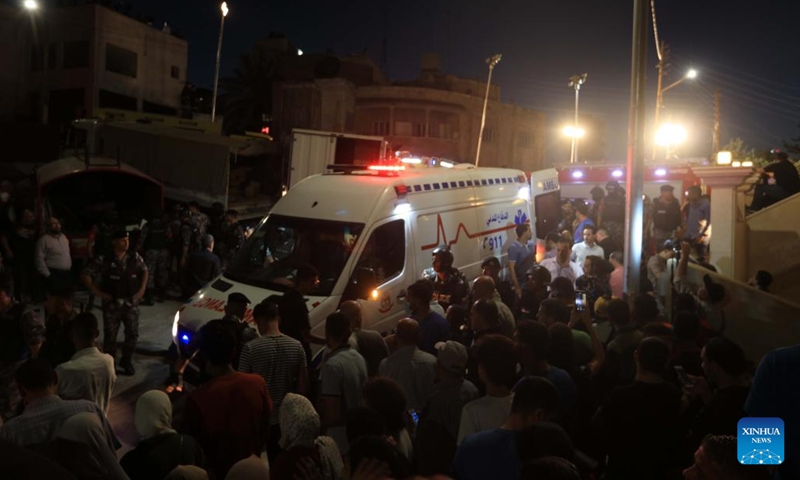 Rescuers transfer a victim to an ambulance after a residential building collapsed in Amman, Jordan, on Sept. 13, 2022. The death toll in the residential building collapse in Amman on Tuesday rose to five, the Public Security Department (PSD) said in a statement.(Photo: Xinhua)