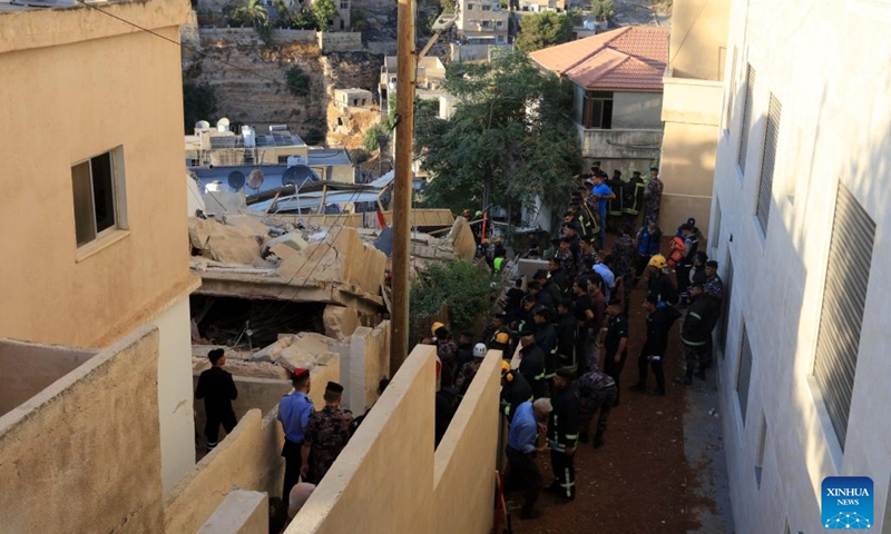 Rescuers search for survivors after a residential building collapsed in Amman, Jordan, on Sept. 13, 2022. The death toll in the residential building collapse in Amman on Tuesday rose to five, the Public Security Department (PSD) said in a statement.(Photo: Xinhua)