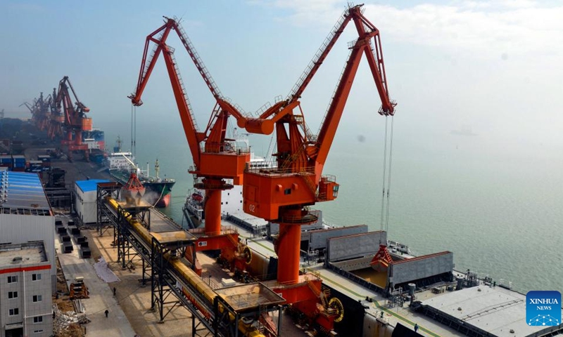 File photo taken on July 9, 2012 shows the automated terminal handling equipment at a 50,000-ton specialized wharf of Qinzhou Port in Qinzhou, south China's Guangxi Zhuang Autonomous Region. After 30 years of development, the Qinzhou Port has been constructed into an international sea-rail intermodal container terminal, operating more than 60 container service routes with a connection to more than 200 ports in over 100 countries and regions around the world.(Photo: Xinhua)