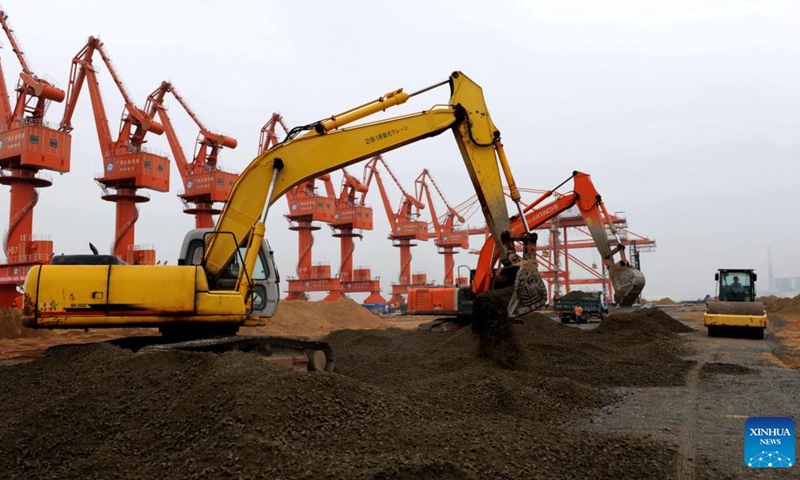 File photo taken on Aug. 8, 2009 shows the construction site of a wharf at Qinzhou Port in Qinzhou, south China's Guangxi Zhuang Autonomous Region. After 30 years of development, the Qinzhou Port has been constructed into an international sea-rail intermodal container terminal, operating more than 60 container service routes with a connection to more than 200 ports in over 100 countries and regions around the world.(Photo: Xinhua)