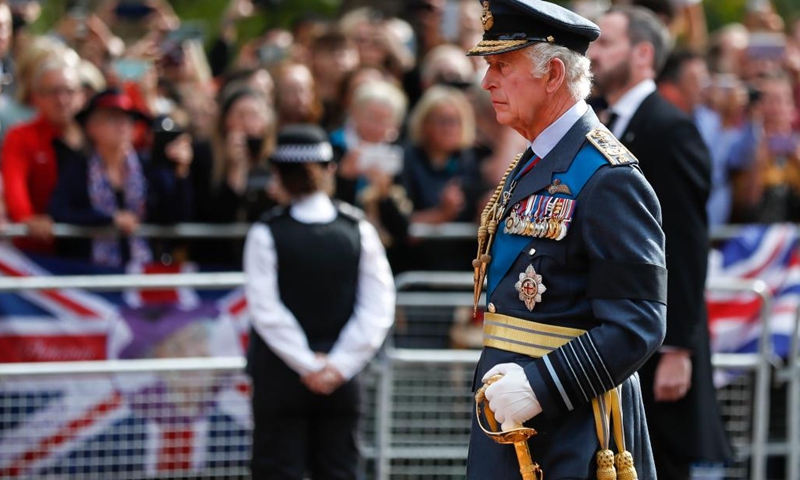 Britain's King Charles III walks behind the coffin of Queen Elizabeth II during a procession from Buckingham Palace to the Westminster Hall for the Queen's lying-in-state in London, Britain, on Sept. 14, 2022.(Photo: Xinhua)