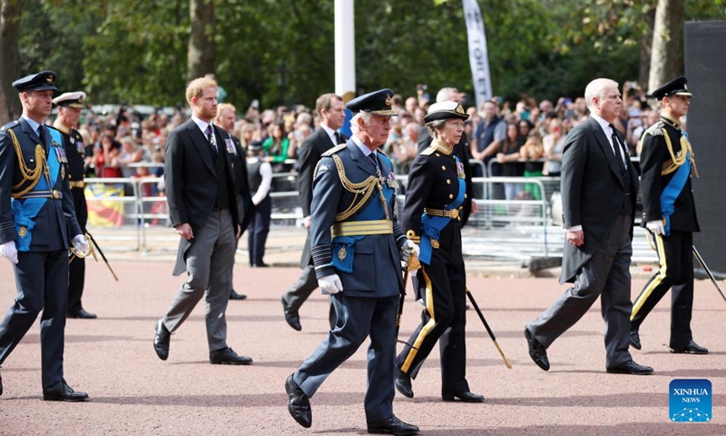 Britain's King Charles III, Princess Anne, Prince Andrew, Prince Edward (L-R, front), Prince William (1st L, back) and Prince Harry (2nd L, back), walk behind the coffin of Queen Elizabeth II during a procession from Buckingham Palace to the Westminster Hall for the Queen's lying-in-state in London, Britain, Sept. 14, 2022.(Photo: Xinhua)