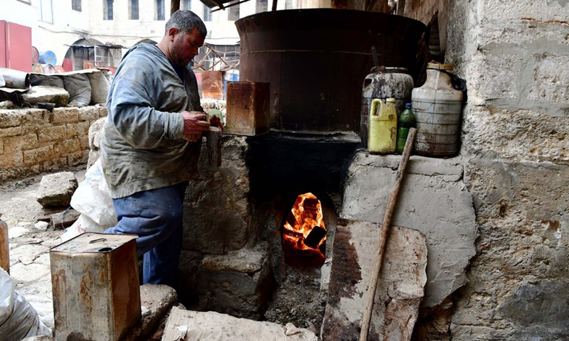 An employee works at the Zanabili soap factory in the old city of Aleppo, northwestern Syria, on March 6, 2022.(Photo: Xinhua)