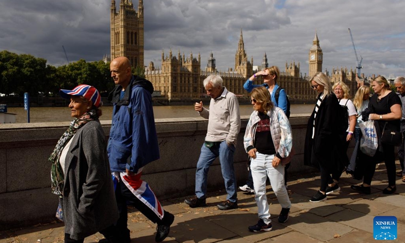 People wait in line to pay tributes to the late Queen Elizabeth II in London, Britain, Sept. 15, 2022. The Queen will lie in state in Westminster Hall for several days before her funeral on Sept. 19.(Photo: Xinhua)