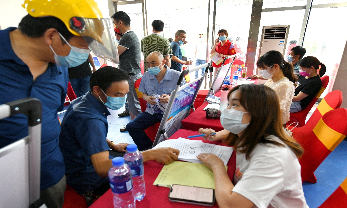 Returning migrant workers and college graduates participate in a job fair in Anqing, East China's Anhui Province, on June 19, 2022. More than 120 enterprises in the city participated in the fair, offering more than 6,000 jobs in industries including biotechnology and new energy. More than 1,100 applicants accepted jobs on the spot. Photo: VCG

