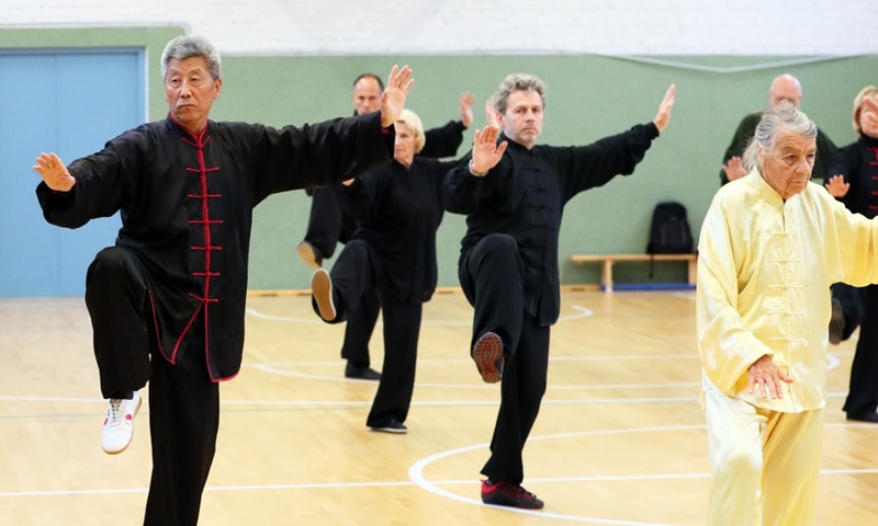 People practice Chinese Tai Chi in Vilnius, Lithuania, Sept. 18, 2022. Dozens of Tai Chi enthusiasts gathered in Vilnius on weekend to practice Tai Chi under the guidance of coach Wang Xiyin, who has been living in Lithuania for more than 30 years and is the Tai Chi coach in the past 20 years. (Photo by Yang Weihua/Xinhua)


