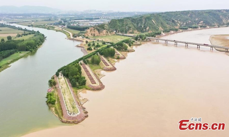 A clear boundary is formed between the colors of green and yellow on the intersection, where Luohe river joins the Yellow river in Gongyi, central China's Henan Province, Sept. 19, 2022. (Photo: China News Service/Wang Kewei)