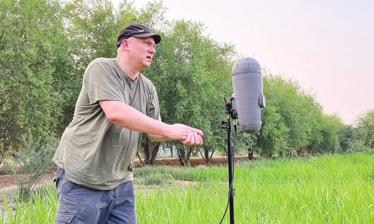 French sound artist Guillaume Rousere collects sounds in the countryside north of the Qatari capital Doha on September 4, 2022. Photo: AFP