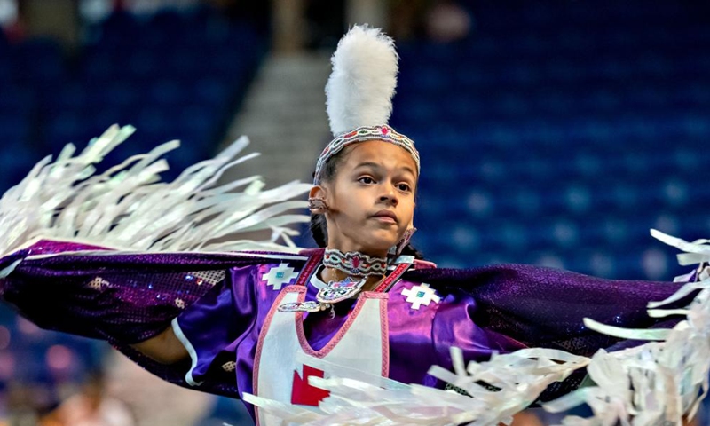 A dancer dressed in indigenous costume partakes in the Pow Wow's dance and celebrations at the Langley Events Centre in Langley, Canada, on Sept. 16, 2022.Photo:Xinhua