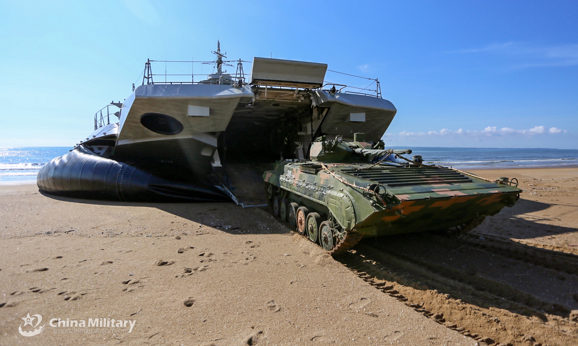 An armored vehicle rolls out of an air cushioned landing craft during a beach landing training exercise conducted by a naval landing ship flotilla under the PLA Southern Theater Command in mid-August, 2022. (eng.chinamil.com.cn/Photo by Zhang Xueyan) 