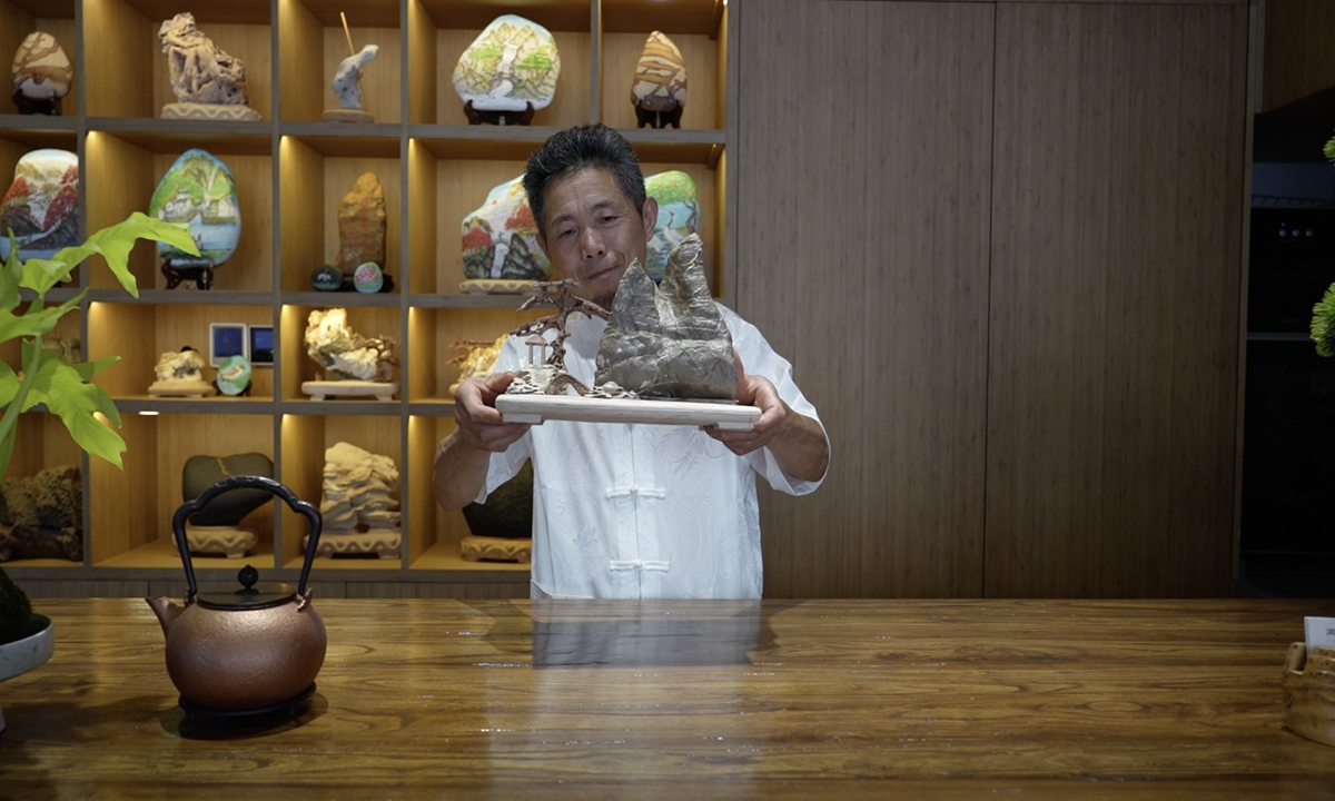 Ge Yuande, once a miner in Yucun village, previously the largest limestone mining area in Anji county, introduces his beloved stones to Global Times reporters. Photo: Li Jieyi/GT 