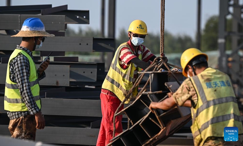 Staff members work at the construction site of the Wenchang International Aerospace City in Wenchang, south China's Hainan Province, Sept. 16, 2022.Photo:Xinhua