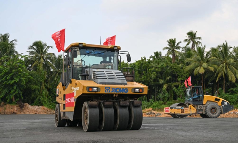 Staff members work at the construction site of the road network at the Wenchang International Aerospace City in Wenchang, south China's Hainan Province, Sept. 14, 2022.Photo:Xinhua