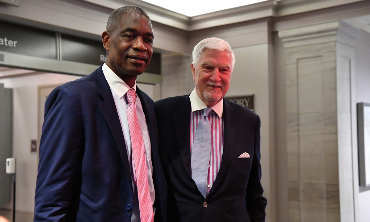 Hall of fame basketball player Dikembe Mutombo (left) and The Honorable Tom McMillen appear at the opening night reception of All American: The Power of Sports exhibit in Washington DC on September 12, 2022. Photo: AFP