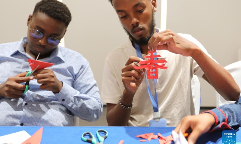 Trainees learn paper-cutting during a Chinese culture program in Djibouti City, capital of Djibouti on Sept. 18, 2022. A Chinese culture program was held here Sunday for young entrepreneurs from Djibouti, Ethiopia, Kenya and Uganda.(Photo: Xinhua)