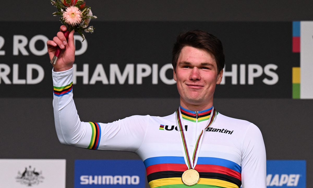Norway's Soren Waerenskjold celebrates on the podium after winning the men's under-23 individual time trial cycling event at the UCI 2022 Road World Championship in Wollongong on September 19, 2022. Photo: AFP