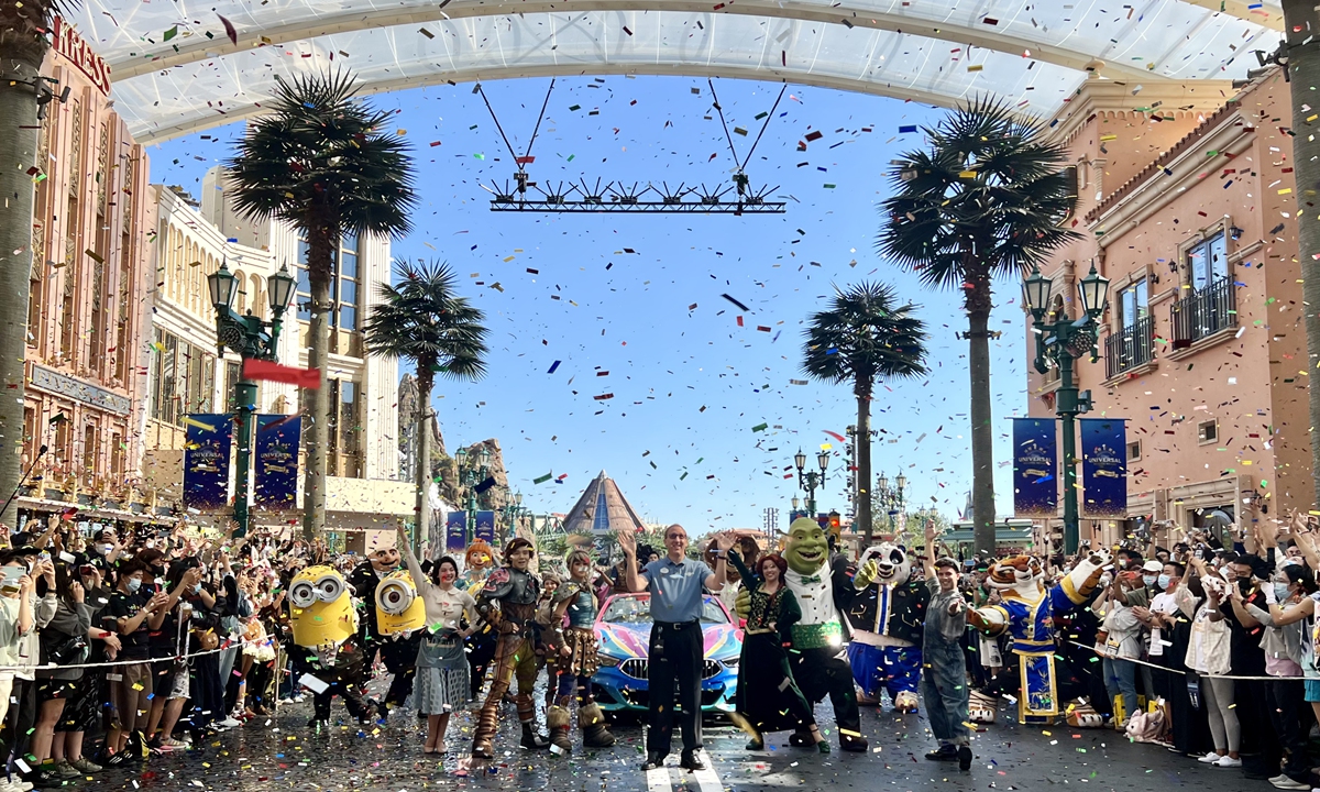 Employees and visitors at the Universal Beijing Resort celebrate its first anniversary on September 20, 2022. Despite the fallout of the COVID-19 epidemic, the theme park has remained a popular destination. Ticket bookings for the resort rose more than 50 percent in August from July, with children's ticket bookings up nearly 70 percent. Photo: cnsphoto