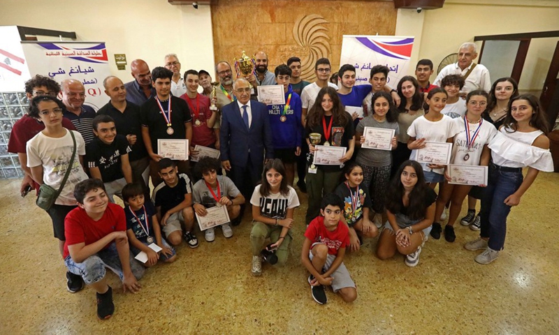 A group photo of Chinese chess contestants with members of the XiangQI Committee in Lebanon after the competition in Bkenaya, Mount Lebanon Governorate, Lebanon, on Sept. 18, 2022.(Photo: Xinhua)
