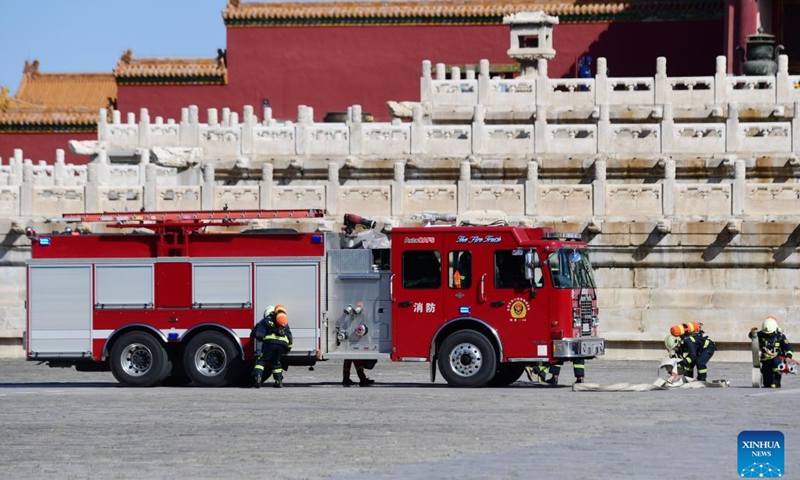 Firefighters participate in a fire drill at the Palace Museum, also known as the Forbidden City, in Beijing, capital of China, Sept. 19, 2022. The drill was held to test and enhance fire prevention and emergency response capabilities at the ancient architectural complex.(Photo: Xinhua)