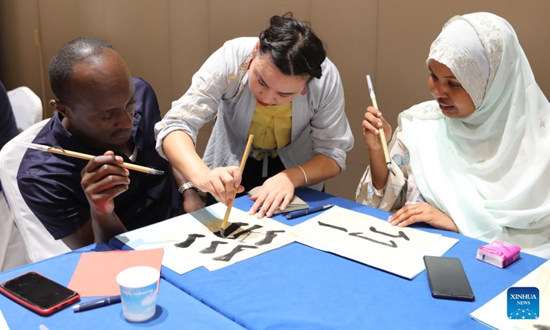 Trainees learn Chinese calligraphy during a Chinese culture program in Djibouti City, capital of Djibouti on Sept. 18, 2022. A Chinese culture program was held here Sunday for young entrepreneurs from Djibouti, Ethiopia, Kenya and Uganda.(Photo: Xinhua)