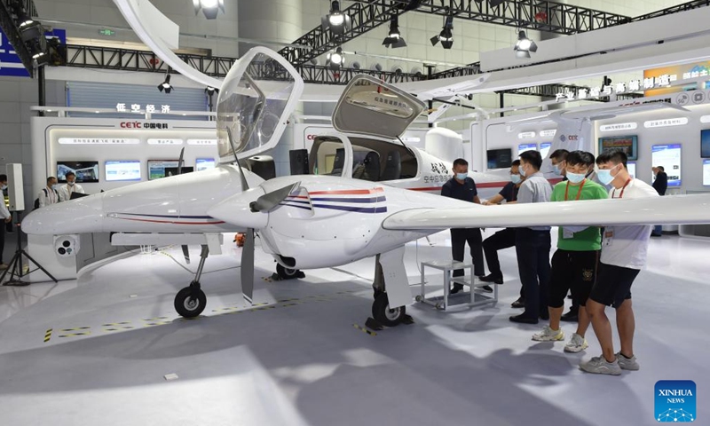 People look at an aircraft at the 2022 World Manufacturing Convention in Hefei, east China's Anhui Province, Sept. 20, 2022. The 2022 World Manufacturing Convention opened Tuesday in east China, highlighting the latest products, technologies and applications in the manufacturing sector. Themed Creating a beautiful world with manufacturing, the four-day event in Hefei, capital city of Anhui Province, features nearly 40 events including exhibitions, seminars and other activities.(Photo: Xinhua)
