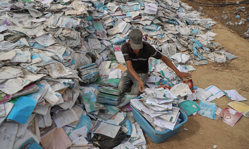 A Palestinian man works at a small factory for papers recycling, in the southern Gaza Strip city of Khan Younis, on Sept. 21, 2022.(Photo: Xinhua)