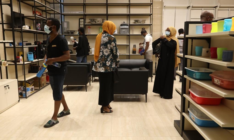 People view cross-border e-commerce products at the Djibouti International Free Trade Zone in Djibouti, Sept. 14, 2022. Inaugurated in 2018 with a planned construction area of 48.2 square km, the Djibouti International Free Trade Zone has attracted more than 200 companies, providing competitive digital services and products.(Photo: Xinhua)