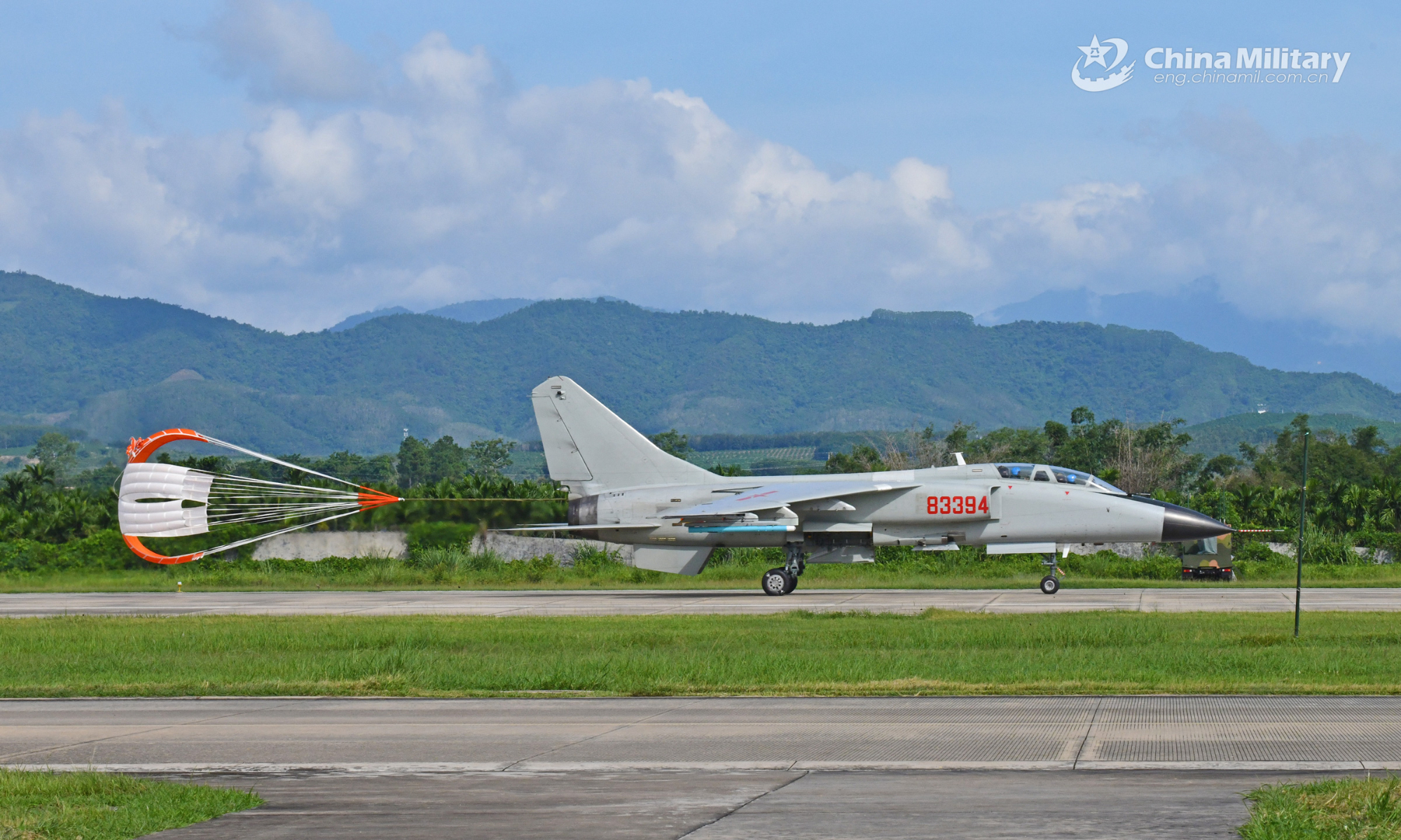 A fighter bomber attached to a naval aviation brigade under the PLA Southern Theater Command decelerates with the help of its drag parachute after landing during a flight training exercise on August 24, 2022. (eng.chinamil.com.cn/Photo by Zhuo Lingpeng)
