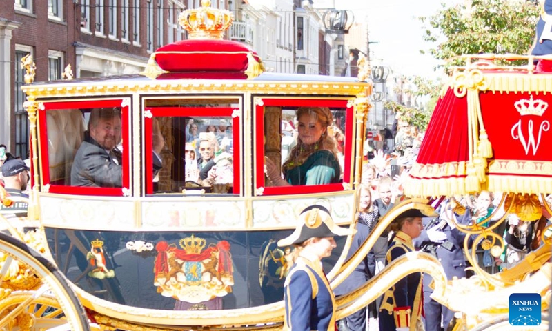 Dutch King Willem-Alexander and Princess Amalia wave to people in the Glass Coach in the Hague, the Netherlands, on the Prince's Day, Sept. 20, 2022. The third Tuesday in September is Prince's Day in the Netherlands. It marks the opening of the Dutch parliamentary season, and on this day the reigning monarch outlines the government's plans for the year ahead.(Photo: Xinhua)