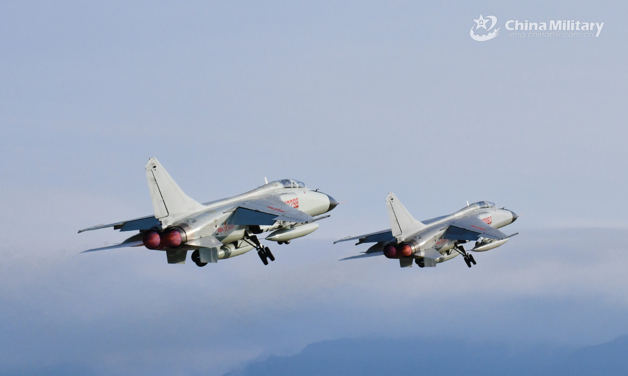 Two fighter bombers attached to a naval aviation brigade under the PLA Southern Theater Command fly in formation during a flight training exercise on August 24, 2022. (eng.chinamil.com.cn/Photo by Zhuo Lingpeng)