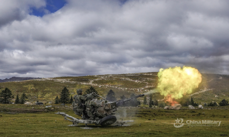 Artillerymen assigned to a brigade under the PLA 77th Group Army operate an anti-aircraft artillery to fire at a mock target during a live-fire air defense training exercise on September 19, 2022. (eng.chinamil.com.cn/Photo by Liu Yanhong)