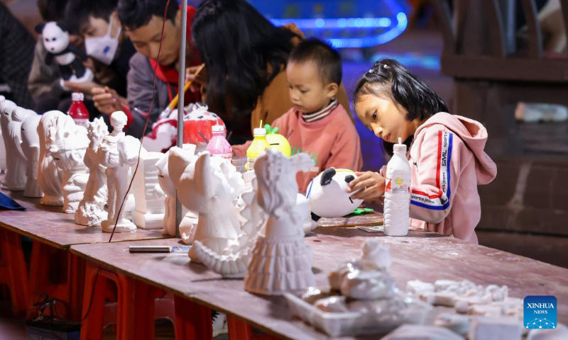 People color plaster statues at a park in Yuping Dong Autonomous County of Tongren City, southwest China's Guizhou Province, Oct. 5, 2022. (Photo by Hu Panxue/Xinhua)
