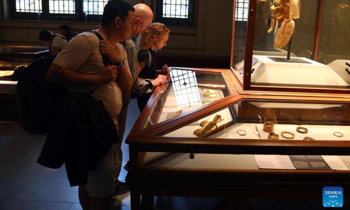 People visit the exhibition of the Treasure of Tanis at Egyptian Museum in Cairo, Egypt, on Oct. 3, 2022. The museum recently opened the exhibition in celebration of the 200th anniversary of the creation of the field of Egyptology and the decoding of ancient hieroglyphs. (Xinhua/Ahmed Gomaa)