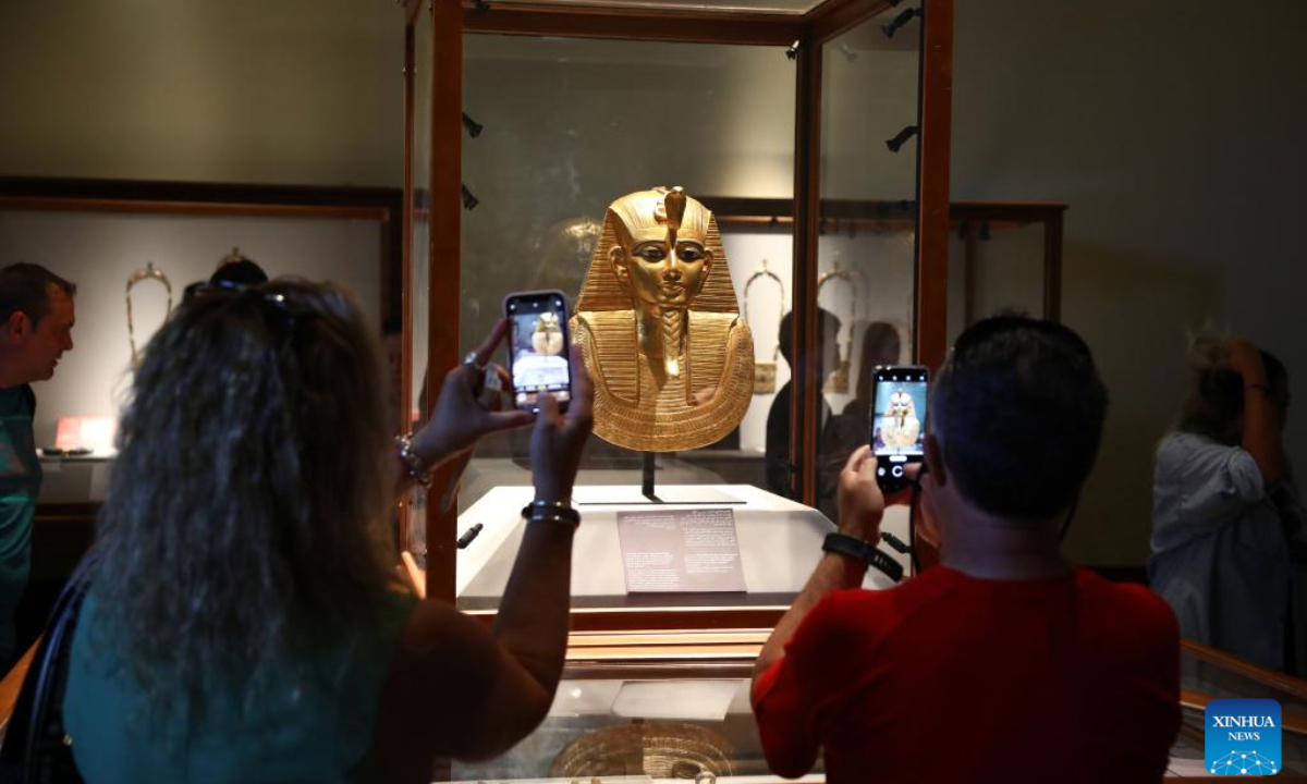 People visit the exhibition of the Treasure of Tanis at Egyptian Museum in Cairo, Egypt, on Oct. 3, 2022. The museum recently opened the exhibition in celebration of the 200th anniversary of the creation of the field of Egyptology and the decoding of ancient hieroglyphs. (Xinhua/Ahmed Gomaa)