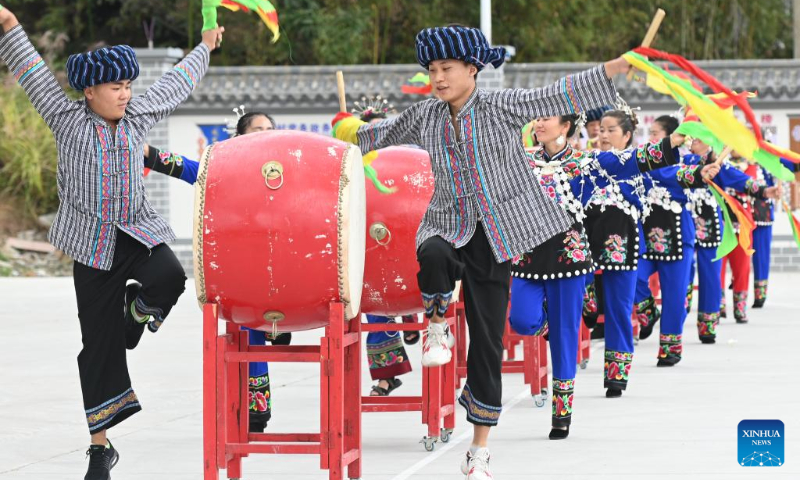 People of Miao ethnic group perform folk dance in Matang Village of Songtao Miao Autonomous County in Tongren, southwest China's Guizhou Province, Oct. 1, 2022. (Photo by Xie Huifang/Xinhua)