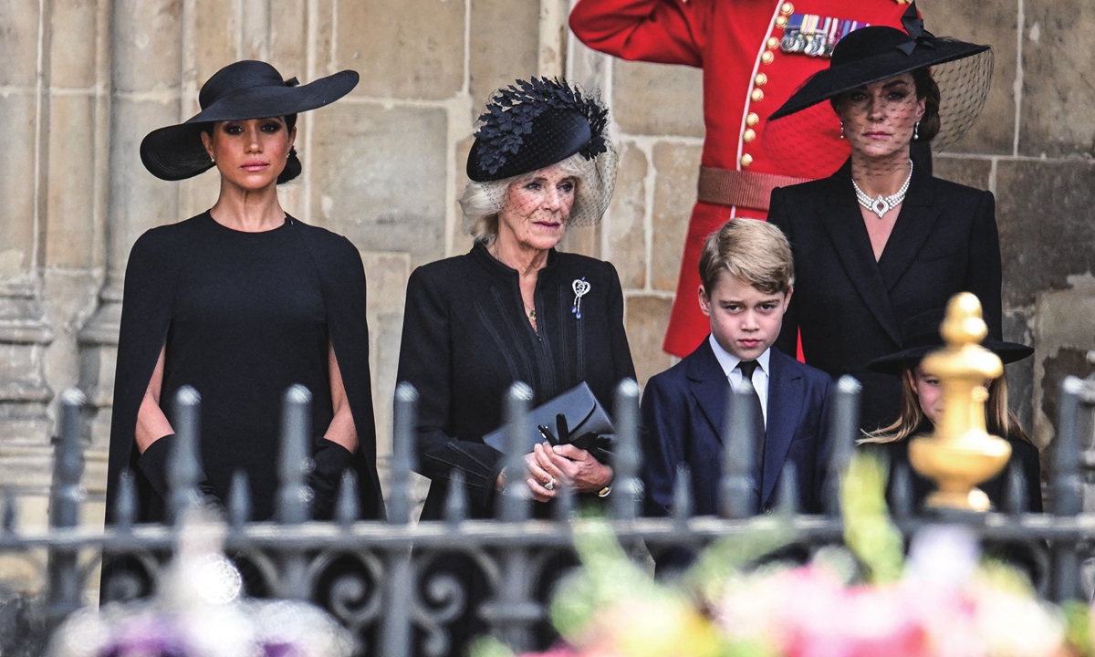 From left: Meghan, Duchess of Sussex, Camilla, Queen Consort, Prince George of Wales and Catherine, Princess of Wales look at the coffin of the late Queen Elizabeth II on September 19, 2022. Photo: AFP