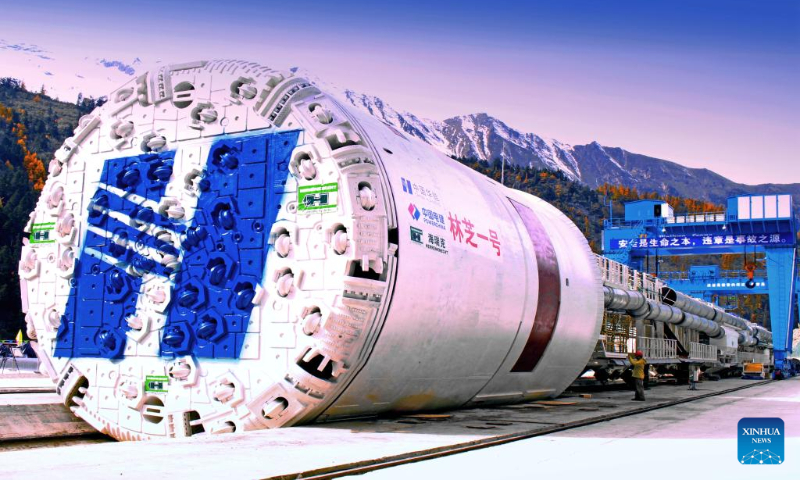 Photo taken on Oct. 29, 2015 shows the tunnel boring machine (TBM) being completed for the construction of Doxong Pass tunnel on the highway linking Pad Township in the city of Nyingchi and Medog County, southwest China's Tibet Autonomous Region. (Photo by Dong Zhixiong/Xinhua)