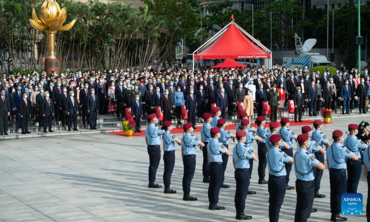 A flag-raising ceremony is held to celebrate the 73rd anniversary of the founding of the People's Republic of China at the Golden Lotus Square in Macao, south China, Oct 1, 2022. Photo:Xinhua
