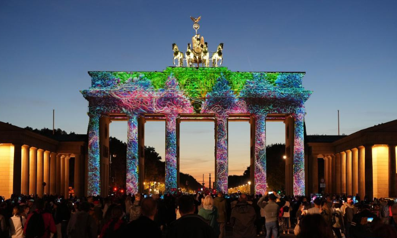 Photo taken on Oct. 7, 2022 shows the Brandenburg Gate illuminated during the 2022 Festival of Lights in Berlin, Germany. (Photo by Stefan Zeitz/Xinhua)