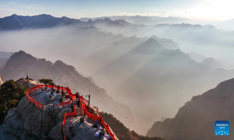 Aerial photo taken on Sept. 25, 2022 shows the view of Mount Huashan at sunset in northwest China's Shaanxi Province. (Xinhua/Tao Ming)