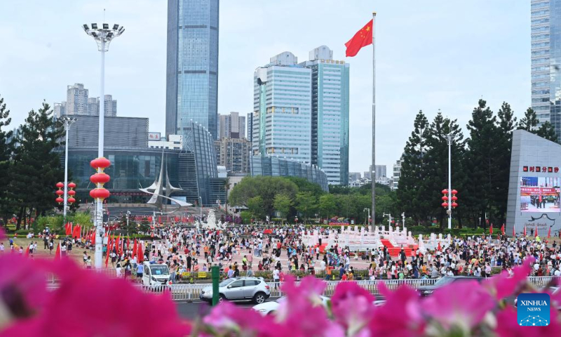 People gather at a square to celebrate the 73rd anniversary of the founding of the People's Republic of China in Fuzhou, southeast China's Fujian Province, Oct. 1, 2022. (Xinhua/Lin Shanchuan)