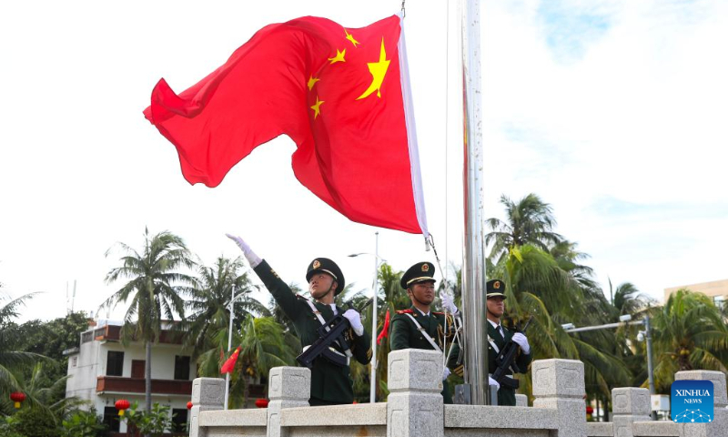 A flag-raising ceremony is held to celebrate the 73rd anniversary of the founding of the People's Republic of China at Yongxing Island of Sansha City, south China's Hainan Province, Oct. 1, 2022. (Photo by Li Yangbao/Xinhua)